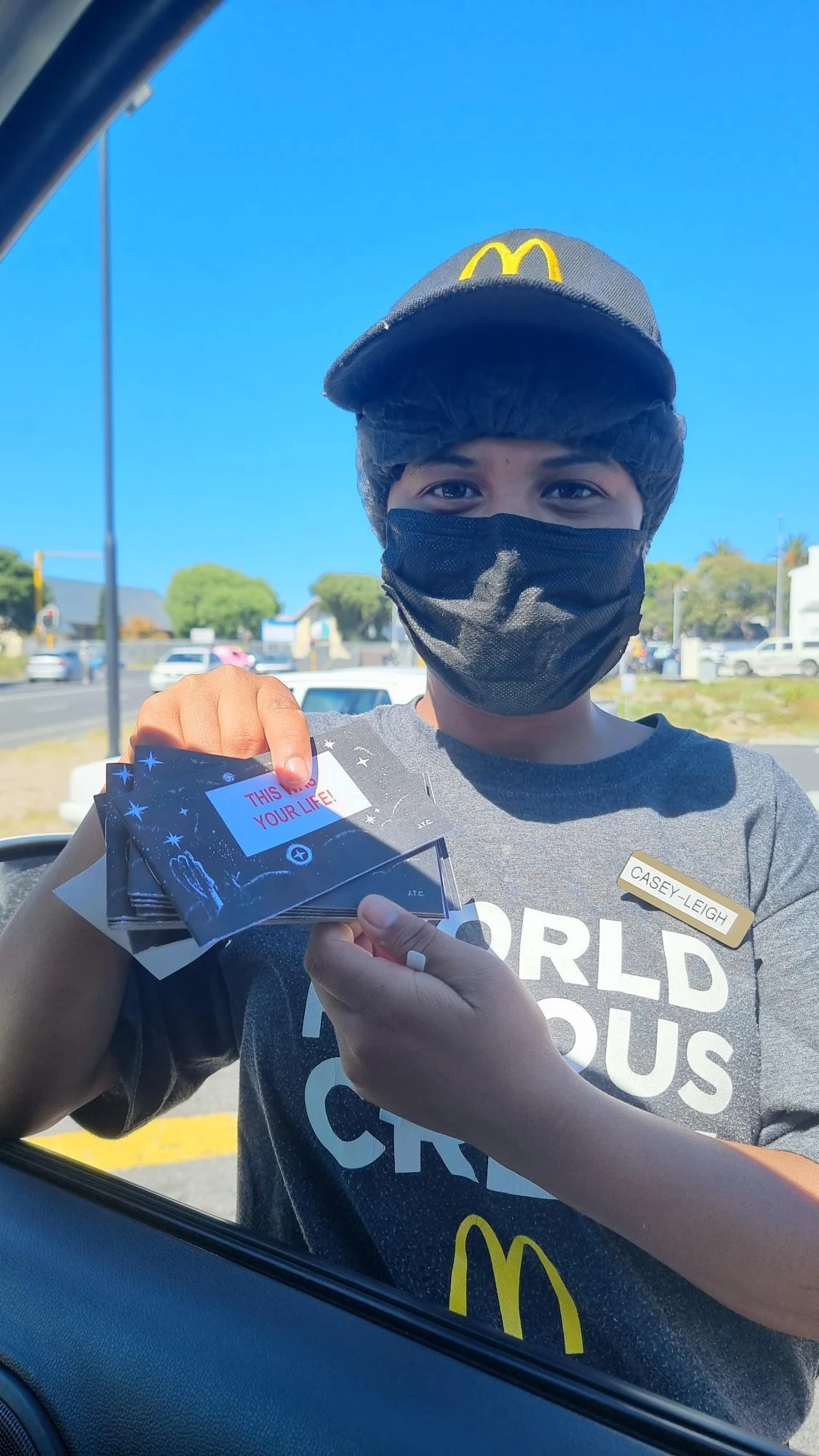 person with pamphlets